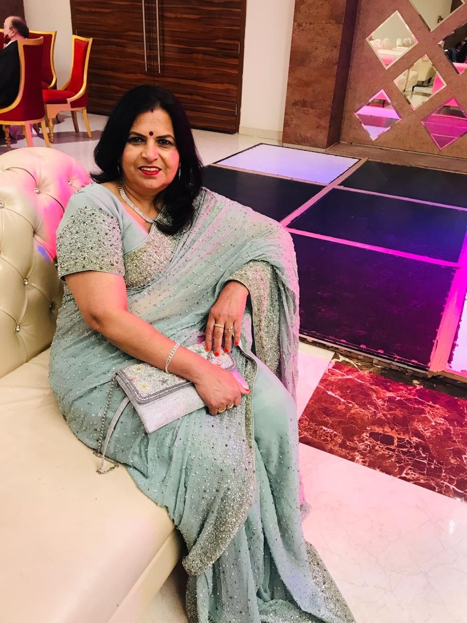 Santosh in a sea-green saree with silver beadwork